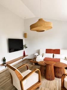 a living room with a couch and a table at Relais De Mantadia in Andasibe
