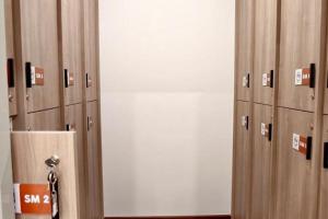 a row of lockers in a locker room at The Rich Cafe & Hostel in Pattaya South