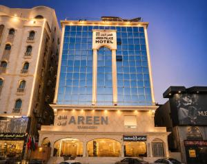a large building with a sign on top of it at Qasr Arin Aprtments For Serviced Apartments شقق قصر ارين للشقق المخدومة in Jeddah