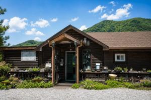 a building with a store with flowers in it at Pyeongchang Estrella Pension in Pyeongchang