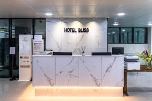 a lobby with a marble counter in a building at Bliss Hotel Myeongdong in Seoul