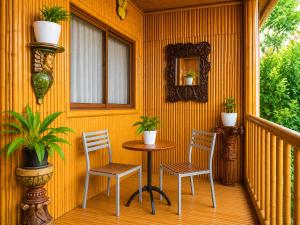 a table and two chairs on a porch at Sky Garden Homestay in Olongapo