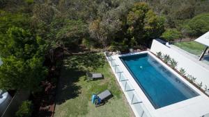 an overhead view of a swimming pool in a backyard at Seaside Beach House in Marcoola