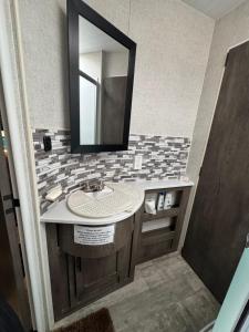 a bathroom with a sink and a mirror at Waxberry Trailer by Kings Canyon and Sequoia National Parks in Squaw Valley +20 photos