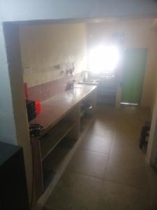 a kitchen with a counter top in a room at Munro haputale in Haputale