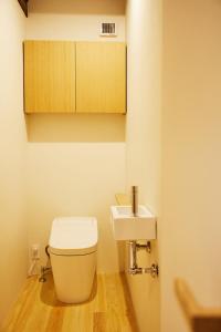 a bathroom with a toilet and a sink at 蔵宿あさぎやみたけ in Ome +16 photos