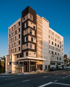 a tall building on the corner of a street at Woodroffe Hotel in Gold Coast