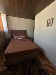 a bedroom with a large bed in a room at Wiracocha Apartments #4 in Pisac