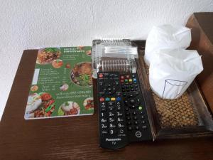 a remote control sitting on top of a table at 22 Seasons Hotel in Ban Khlong Chi Lat
