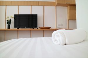 Postel nebo postele na pokoji v ubytování Hinoki Hotel - ONSEN Chiang Mai