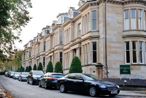 a row of cars parked in front of a building at One Devonshire Gardens a Hotel Du Vin in Glasgow