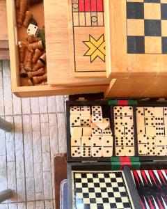 a wooden box with dominoes and a chess board at Patrick's on the Beach Resort in General Luna +169 photos