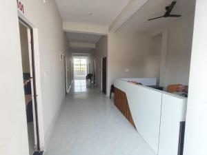 a hallway of a house with a ceiling fan at Pramod Residency in Chitrakoot