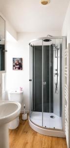 a bathroom with a shower and a sink and a toilet at Marans in Marans