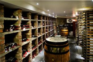 a wine tasting room with a bunch of wine bottles at One Devonshire Gardens a Hotel Du Vin in Glasgow
