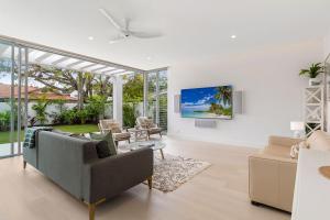a living room with a couch and a table at Key Court 17 in Noosa Heads