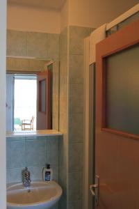 a bathroom with a sink and a window at Apartments Sv.Jakov in Dubrovnik +88 photos