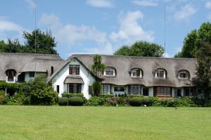 a house with a large yard in front of it at Rawdons Hotel & Brewery in Nottingham Road