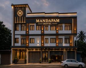 a hotel with a car parked in front of it at Mandapam Hotel & Restaurant in Dhanbād