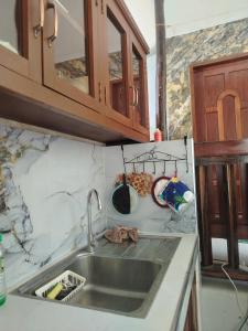 a kitchen with a sink and a counter top at Mamatitas in San Vicente