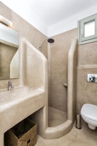 a bathroom with a sink and a toilet at Glyfada's Villa in Kastraki Naxou