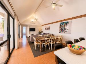 a dining room with a table and chairs at Longer Days at Halcyon Daze in Dunsborough