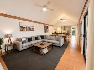 a living room with a couch and a table at Longer Days at Halcyon Daze in Dunsborough