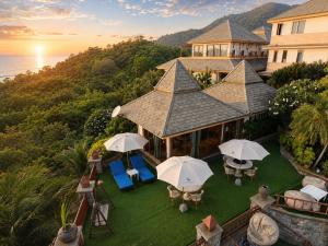 an aerial view of a house with umbrellas at Ko Tao Paradise Resort in Ko Tao