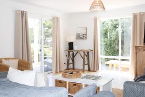 a living room with a couch and a table at 'The Perch' - Central location in Robe, park your car and walk to everything in Robe