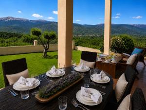 a table with plates and napkins on it with a view at Penelope Dream Pool Villa in Minia