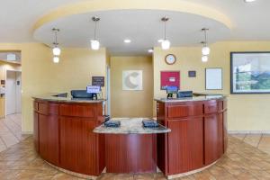 a lobby of a hospital with two large wooden stations at Comfort Suites Longmont in Longmont