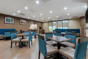 a dining room with tables and chairs at Comfort Inn Binghamton I-81 in Binghamton