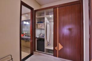 a sliding glass door with a sink in a kitchen at Avari Boutique Multan in Multan