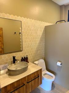 a bathroom with a sink and a toilet at Secret Cottages Chaweng Noi in Koh Samui +46 photos