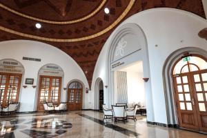a lobby with chairs and tables in a building at Sentido Akassia Beach Resort in Quseir