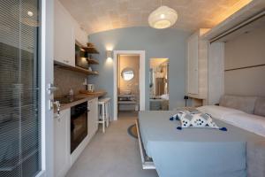 a small apartment with a kitchen and a living room at Dimora Sofia, Charming House in Savelletri di Fasano +12 photos