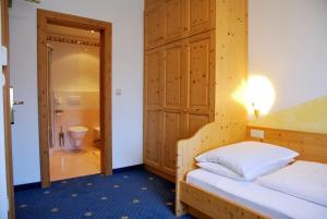 Postel nebo postele na pokoji v ubytování Hotel Urthaler