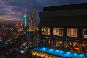 a view of the city at night from a building at Amari Colombo, Sri Lanka in Colombo
