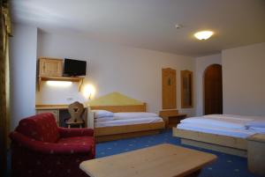 Postel nebo postele na pokoji v ubytování Hotel Urthaler