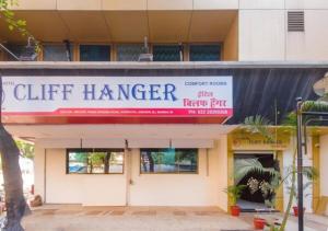 a building with a sign that reads gift manager at Hotel Cliff Hanger in Mumbai