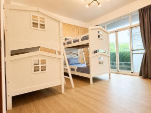 a bunk bed room with two bunk beds in it at Songfeng B&B in Luye