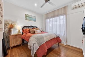 a bedroom with a bed and a window at Styled Entertainer only mins from CBD in Bendigo