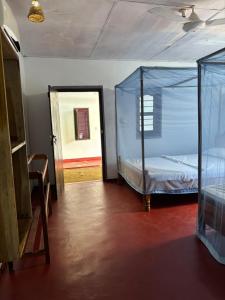 a bedroom with a bed in a glass tent at Lime pepper in Pottuvil