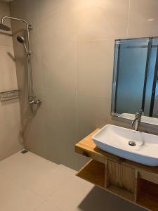 a bathroom with a sink and a shower at Zukara Maldives in Thoddoo +4 photos