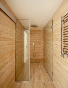 a shower with a phone in a wooden wall at The Republic Boutique Hotel in Valletta +34 photos