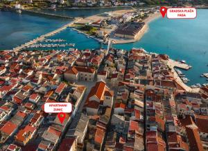 an aerial view of a city with a harbor at Apartmani Žunić in Pag