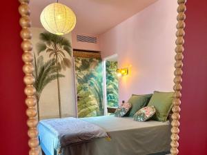 a bedroom with a canopy bed with a mirror at Alpa Nera in Galeria +75 photos