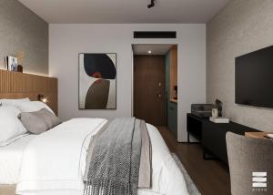 a bedroom with a large bed and a flat screen tv at Tailormade Hotel Median Niš in Niš