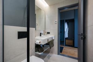 a bathroom with a sink and a mirror at New apartment in Karlova in Tartu +22 photos