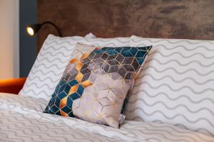 a pillow sitting on top of a bed at New apartment in Karlova in Tartu